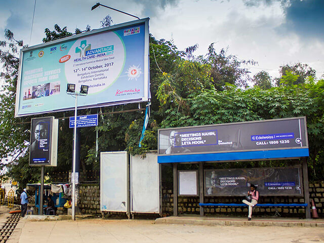 Bangalore city bus featuring Times OOH advertisement, highlighting effective outdoor branding in urban transit.