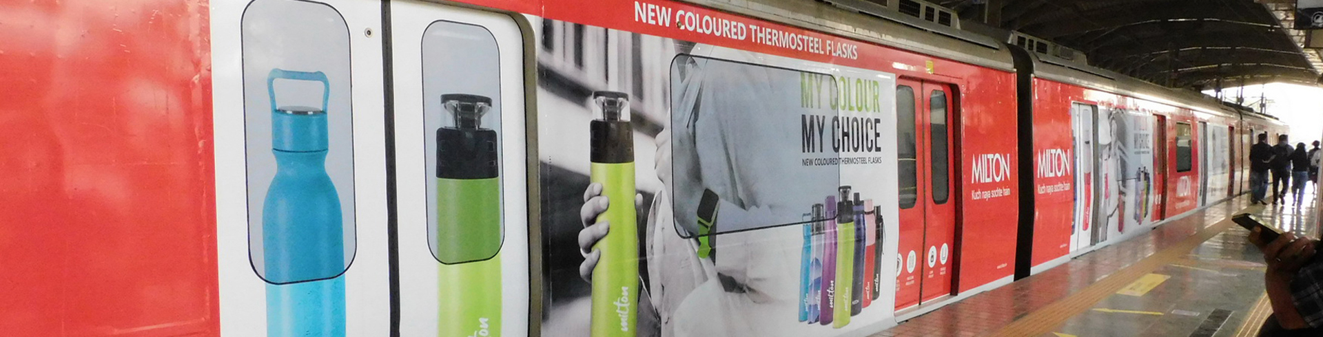 Times OOH premium advertising display at a bustling transit hub, showcasing impactful brand messaging